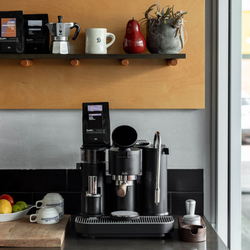 A Meraki home espresso machine staged on a kitchen counter